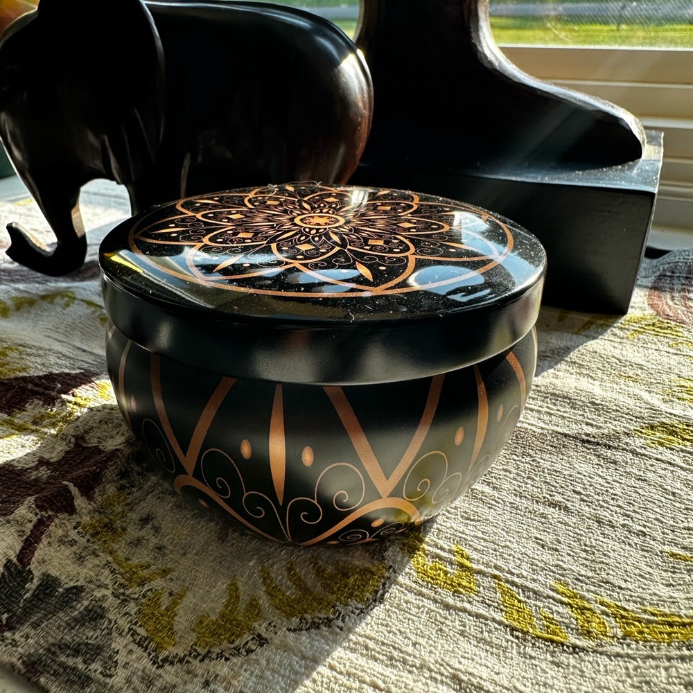 3 1/2 ounce soy candle dragons blood with fireside scent in a reusable tin